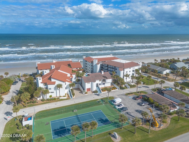 bird's eye view with a water view and a view of the beach