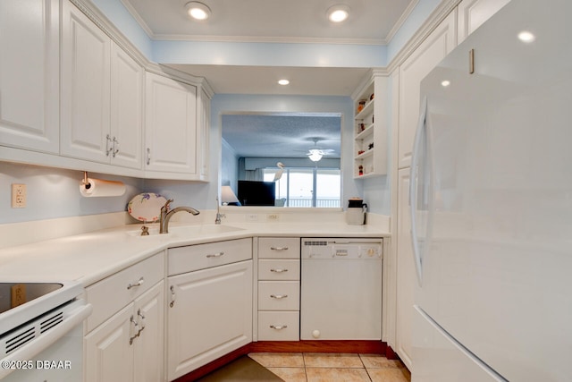 kitchen featuring white appliances, light tile patterned floors, light countertops, white cabinetry, and a sink