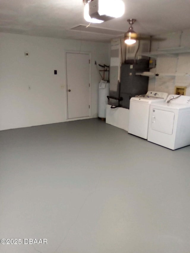 317 Glenbriar Cir, Daytona Beach, FL 32114 - garage featuring washer and dryer and a garage door opener