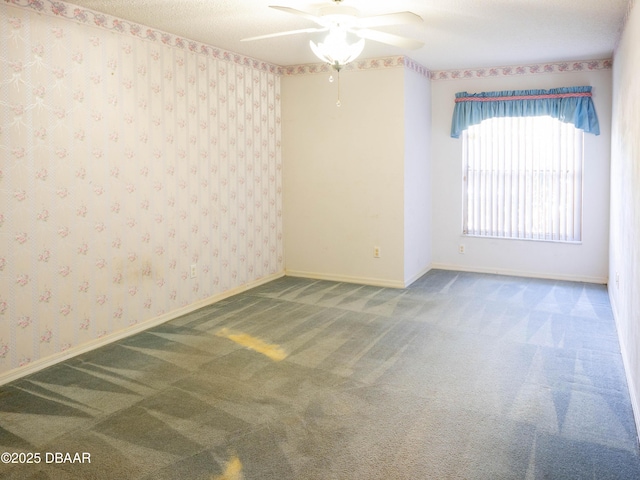 carpeted empty room with ceiling fan