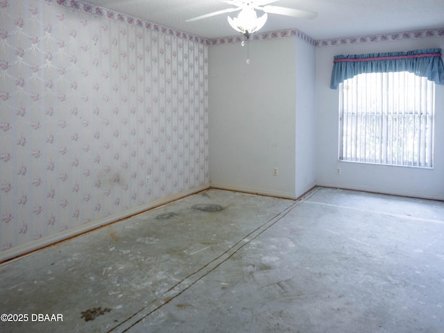 317 Glenbriar Cir, Daytona Beach, FL 32114 - empty room with a ceiling fan and baseboards
