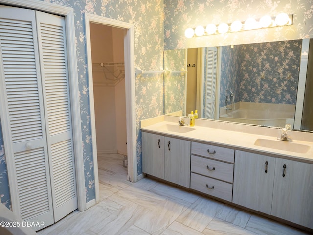 bathroom featuring vanity and a tub