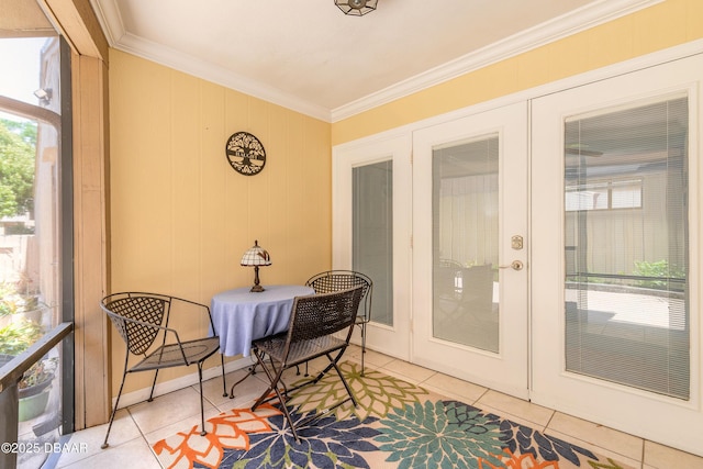 sunroom / solarium featuring french doors