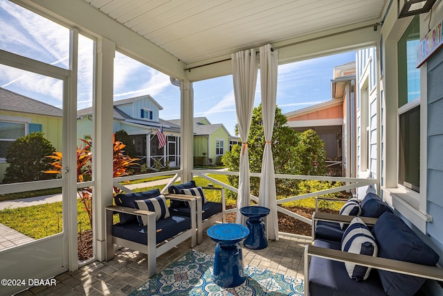 sunroom with wooden ceiling and a healthy amount of sunlight