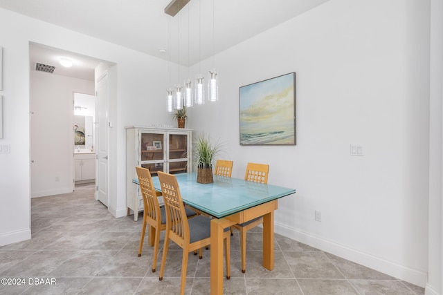 dining area with light tile patterned floors