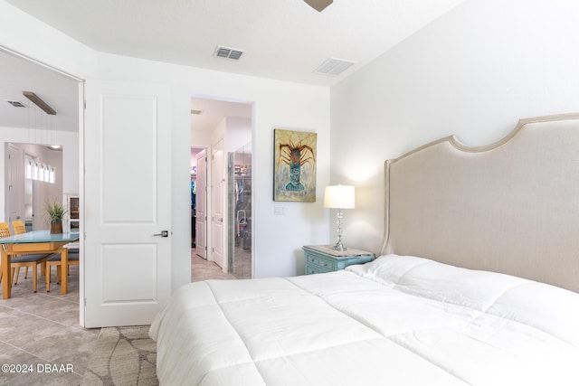 bedroom featuring light tile patterned flooring