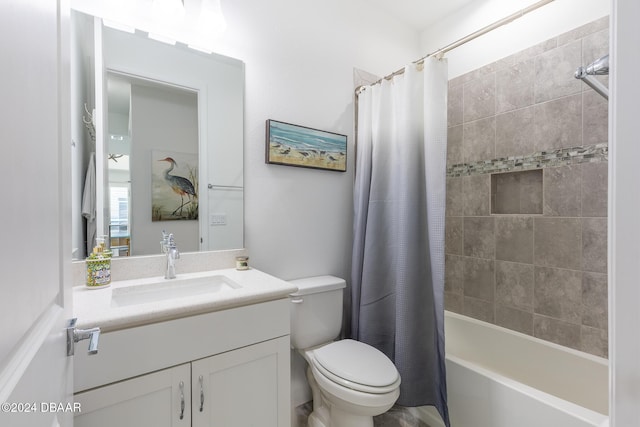 full bathroom with vanity, shower / bath combination with curtain, and toilet