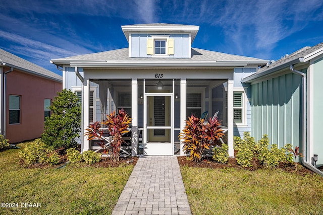 property entrance with a yard