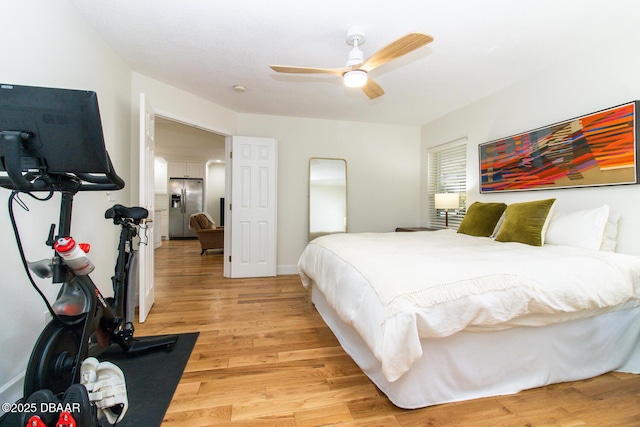 1327 Wayne Ave, New Smyrna Beach, FL 32168 - bedroom featuring stainless steel fridge, light wood finished floors, and ceiling fan