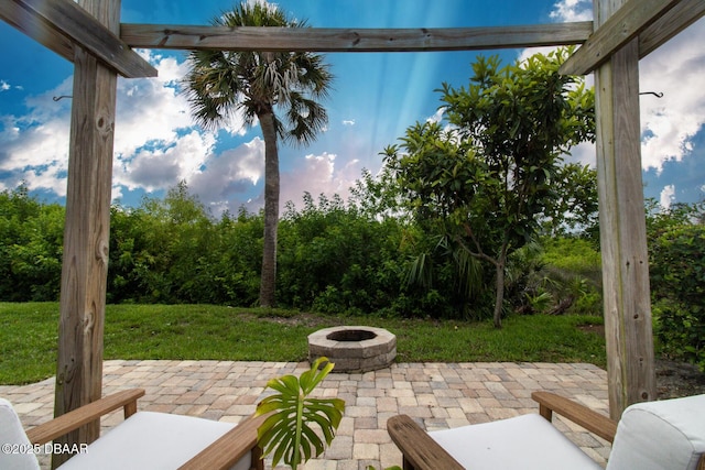 1327 Wayne Ave, New Smyrna Beach, FL 32168 - view of patio featuring a fire pit