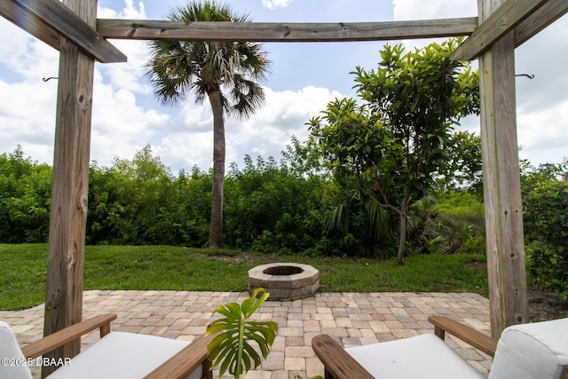 1327 Wayne Ave, New Smyrna Beach, FL 32168 - view of patio with an outdoor fire pit