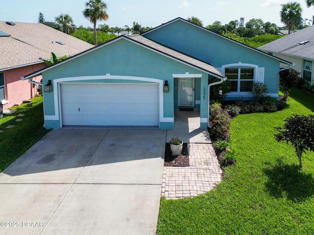 1327 Wayne Ave, New Smyrna Beach, FL 32168 - ranch-style home featuring stucco siding, concrete driveway, an attached garage, and a front yard