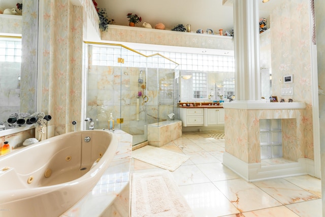 bathroom featuring vanity and separate shower and tub