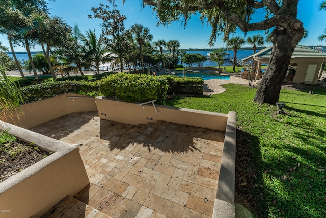 view of patio with a water view