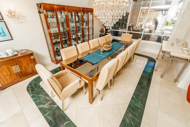 tiled dining area featuring a notable chandelier