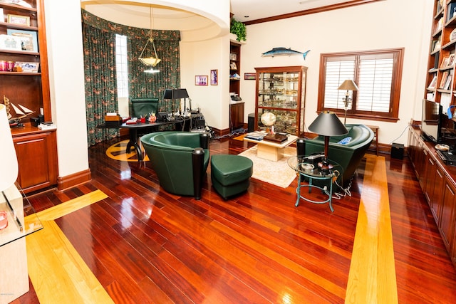 living room with hardwood / wood-style floors and crown molding