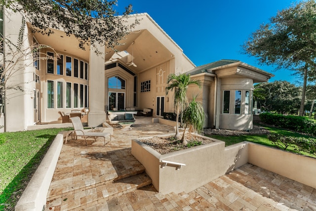 back of house featuring a patio