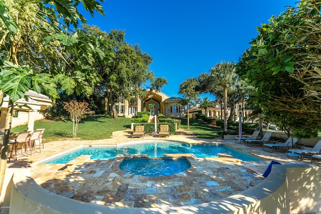 view of pool with a yard and a patio area