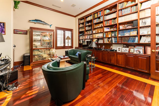 living area featuring dark hardwood / wood-style flooring and ornamental molding