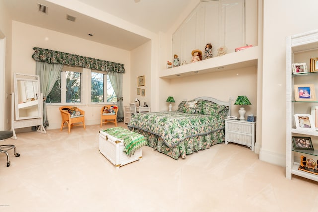 bedroom with high vaulted ceiling and carpet flooring