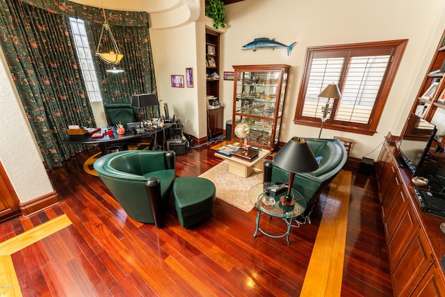 sitting room with dark hardwood / wood-style flooring