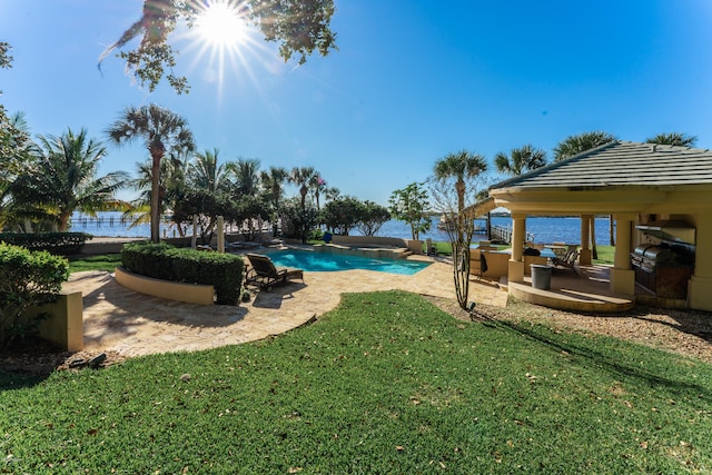 view of pool featuring a patio area, a water view, a lawn, and a gazebo