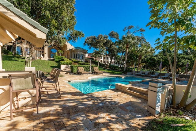 view of swimming pool featuring a patio