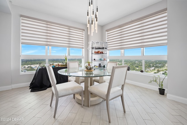 dining area featuring light wood-type flooring