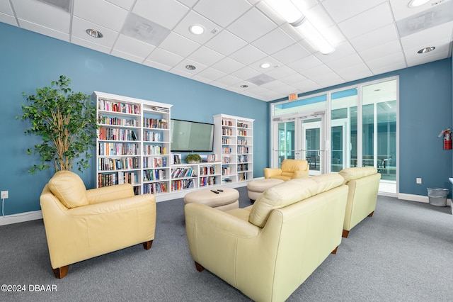 living room featuring french doors and carpet