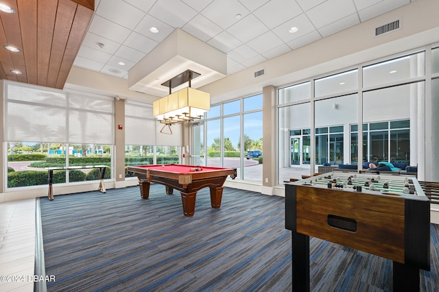 game room featuring a towering ceiling, pool table, and carpet