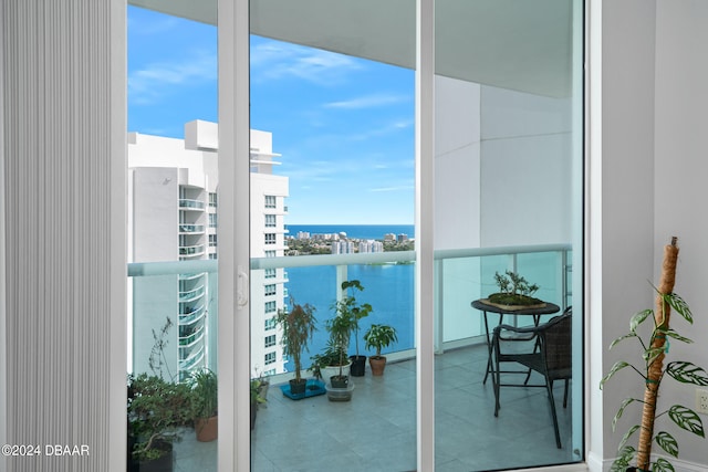 balcony featuring a water view
