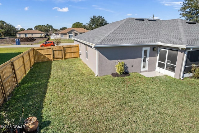 exterior space featuring a sunroom and a lawn