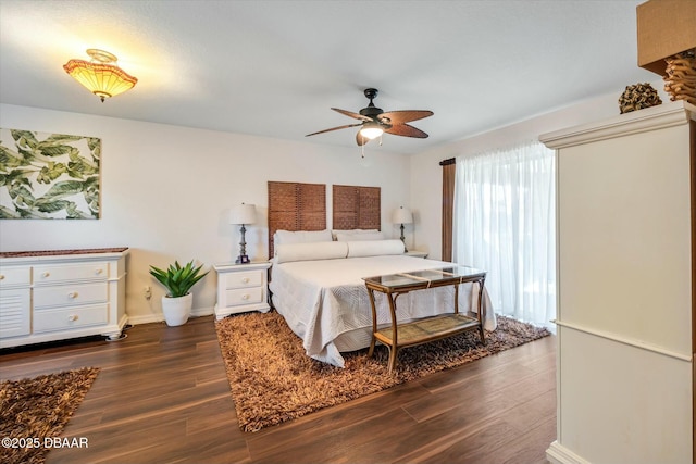 bedroom with dark wood-type flooring and ceiling fan