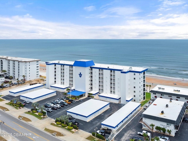 bird's eye view of a large body of water and apartment complex / building