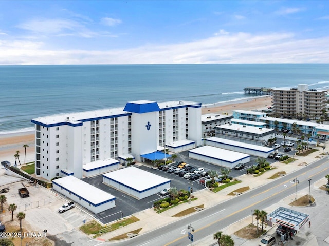 aerial view of a nearby body of water and apartment complex / building