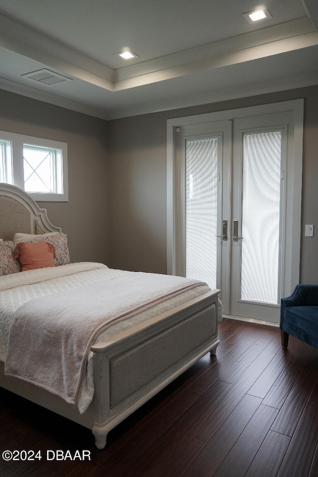 bedroom with dark wood-type flooring