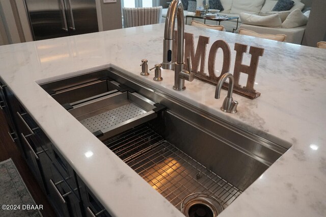 details featuring sink and stainless steel refrigerator