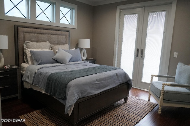 bedroom with french doors and dark hardwood / wood-style flooring