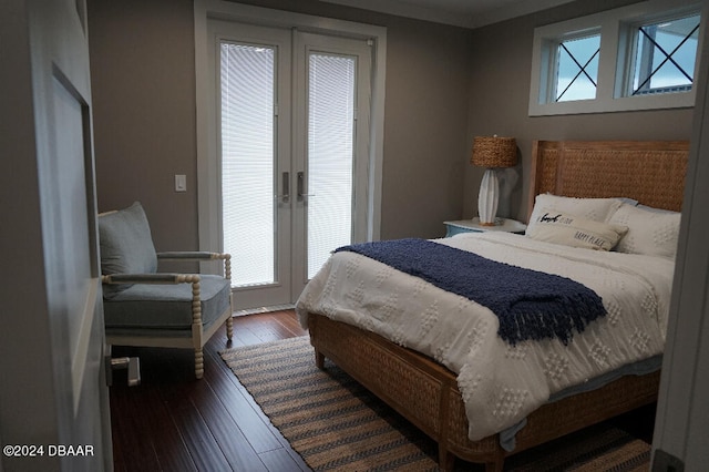 bedroom with french doors, dark hardwood / wood-style flooring, and multiple windows