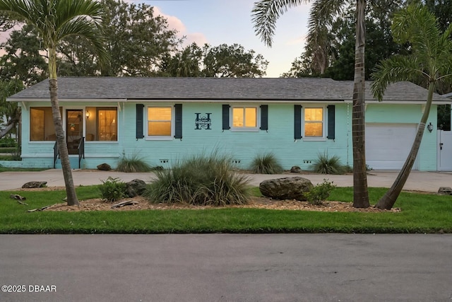 1146 Riverside Dr, Holly Hill, FL 32117 - ranch-style house with a garage and concrete driveway
