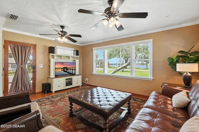 1146 Riverside Dr, Holly Hill, FL 32117 - living area with wood finished floors, a ceiling fan, and ornamental molding