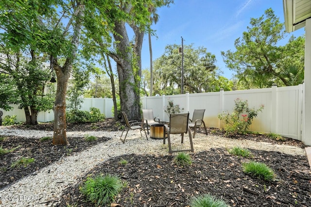 1146 Riverside Dr, Holly Hill, FL 32117 - fenced backyard featuring a patio