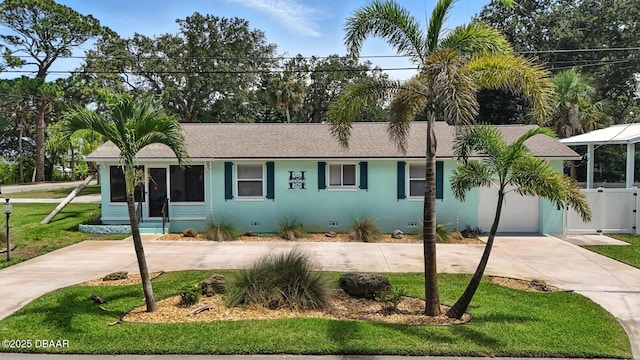 1146 Riverside Dr, Holly Hill, FL 32117 - single story home featuring crawl space, concrete driveway, a front lawn, an attached garage, and a shingled roof