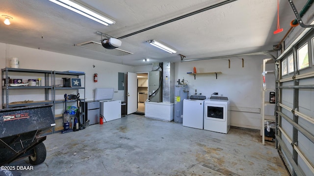 garage with electric panel, heating unit, electric water heater, separate washer and dryer, and a garage door opener