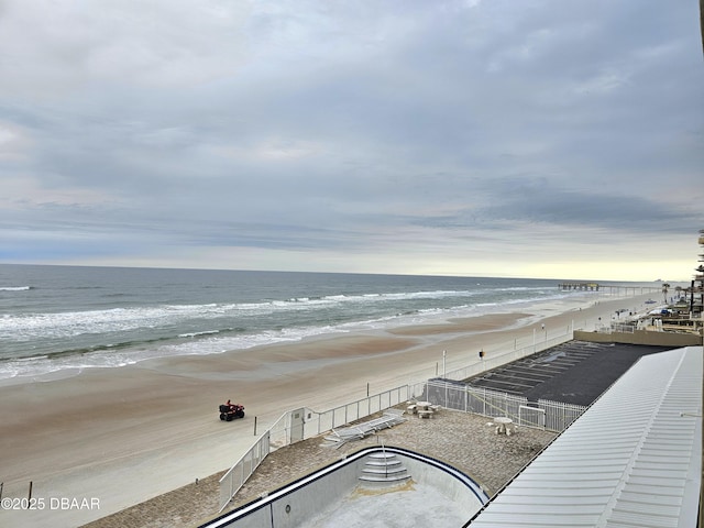 view of water feature with a beach view