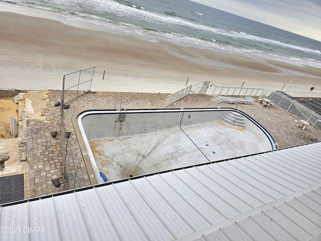 view of pool with a water view