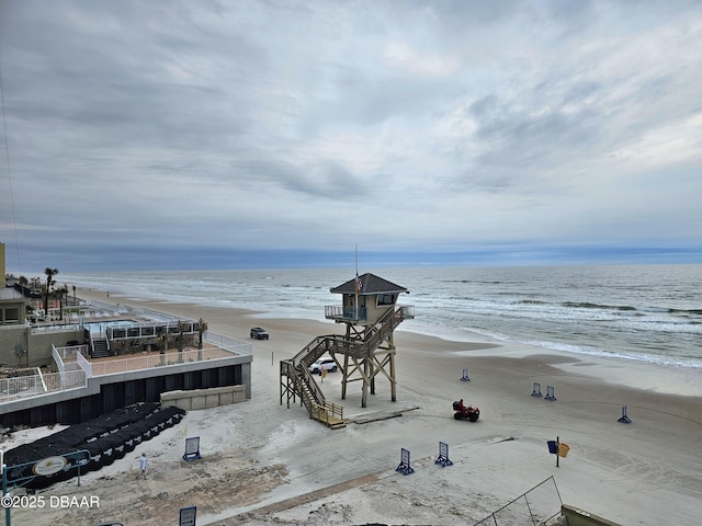 property view of water featuring a beach view