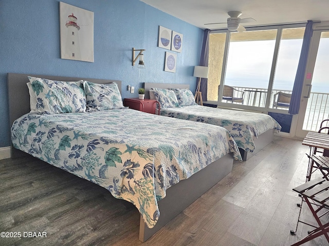 bedroom with ceiling fan, wood-type flooring, and access to outside