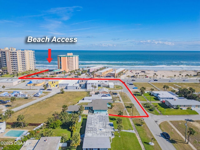 aerial view featuring a water view and a beach view