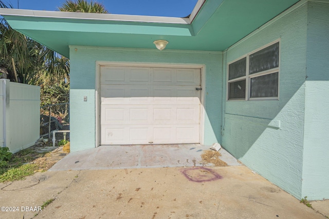 garage featuring fence